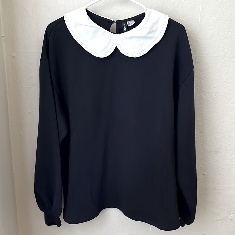 Black sweater shirt with attached white Peter Pan collar